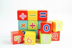 Number wood block cubes for learning Mathematic, education math concept. photo