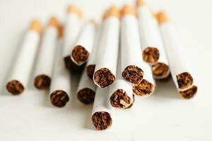 Cigarette, roll tobacco in paper with filter tube, No smoking concept. photo