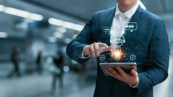 AI technology chatbot, businessman using tablet to communicate with AI and ask business questions, Using artificial intelligence solves human problems for users to achieve intelligent results. photo