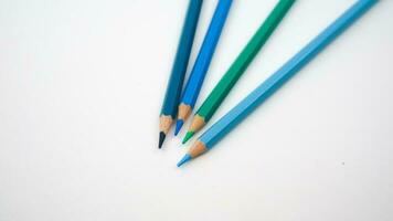 set of colored pencils, blue palette isolated photo