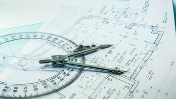Office blue print with drawing compass and ruler photo
