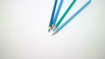 set of colored pencils, blue palette isolated photo