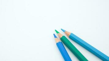 set of colored pencils, blue palette isolated photo