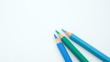 set of colored pencils, blue palette isolated photo