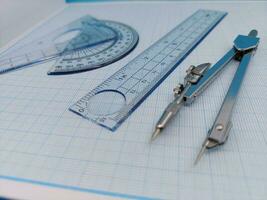 Compass and protractor for math and engineers or architect Drawing compass photo