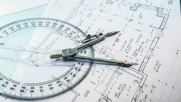 Office blue print with drawing compass and ruler photo