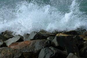 Sea waves and bubbles generated by the rokcs photo