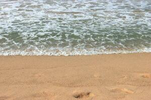 Soothing waves crashing on beach photo