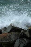 Sea waves and bubbles generated by the rokcs photo