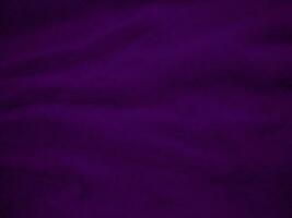 Purple clean wool fabric texture background. light natural sheep wool. Violet seamless cotton. texture of fluffy fur for designers. close-up fragment wool carpet. photo