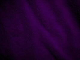 Purple clean wool fabric texture background. light natural sheep wool. Violet seamless cotton. texture of fluffy fur for designers. close-up fragment wool carpet. photo