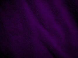 Purple clean wool fabric texture background. light natural sheep wool. Violet seamless cotton. texture of fluffy fur for designers. close-up fragment wool carpet. photo