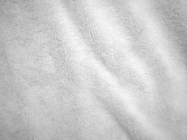 White clean wool texture background. light natural sheep wool. white seamless cotton. texture of fluffy fur for designers. close-up fragment white wool carpet. photo