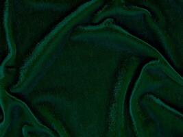 Green velvet fabric texture used as background. Empty green fabric background of soft and smooth textile material. There is space for text. photo