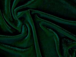 Green velvet fabric texture used as background. Empty green fabric background of soft and smooth textile material. There is space for text. photo