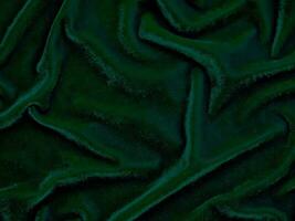 textura de tela de terciopelo verde utilizada como fondo. fondo de tela verde vacío de material textil suave y liso. hay espacio para el texto. foto