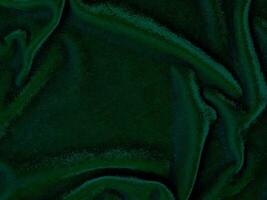 Green velvet fabric texture used as background. Empty green fabric background of soft and smooth textile material. There is space for text. photo