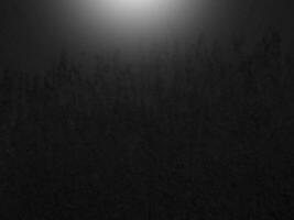 Background gradient black overlay abstract background black, night, dark, evening, with space for text, top light for a background. photo