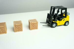 Wooden crates are picked up by a forklift. Preparation of order for shipment. Efficient process of preparing orders for shipment. It signifies the importance of proper packaging and logistics photo