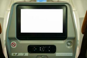 Blank LCD screen on airplane cabin for graphic display montage. photo