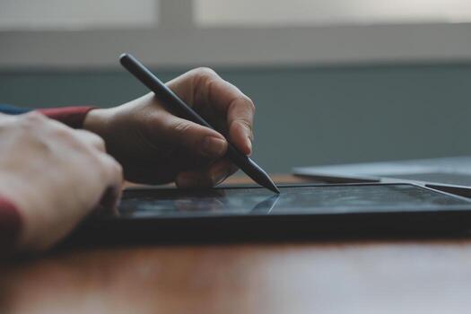 Asian Businesswoman Using laptop computer and working at office with calculator document on desk, doing planning analyzing the financial report, business plan investment, finance analysis concept. photo