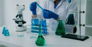 Medical Development Laboratory Caucasian Female Scientist Looking Under Microscope, Analyzes Petri Dish Sample. Specialists Working on Medicine, Biotechnology Research in Advanced Pharma Lab photo