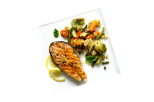 Grilled salmon steak and vegetables on transparent background png