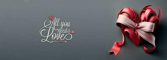 All You Need Is Love Text With 3D Reder Of Red Silk Ribbon Forming Heart Shape On Grey Background. photo