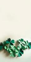 Green Paper Clover Leaves Decorated White Background And Copy Space. St. Patrick's Day Concept. photo