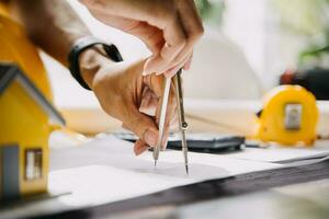 architect man working with laptop and blueprints,engineer inspection in workplace for architectural plan,sketching a construction project ,selective focus,Business concept vintage color photo