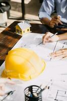 architect man working with laptop and blueprints,engineer inspection in workplace for architectural plan,sketching a construction project ,selective focus,Business concept vintage color photo