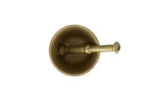 Antique brass mortar with pestle isolated on white background photo