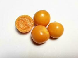 Ripe golden berry fruits, or Cape gooseberry, or Physalis isolated on white background. photo