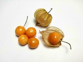 Ripe golden berry fruits, or Cape gooseberry, or Physalis isolated on white background. photo