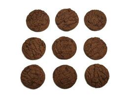 Several round shaped chocolate biscuits isolated on a white background. photo
