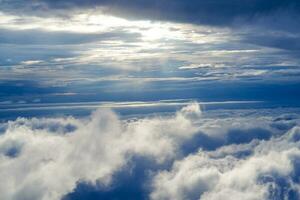 Aerial view of sunrise above fluffy sea fog misty clouds. Sea fog in the morning on rainy season. Abstract nature landscape background in morning. photo