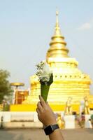 Flower cones are made from using banana leaves or quilling paper to form a cone. to put flowers, incense, candles for worship or Paying respects to sacred objects according to Buddhist rituals . photo