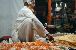 7th April 2023, Zakaria Street, Kolkata, West Bengal, India. Very Tasty Halwa and Paratha at Kolkata Zakaria Street During Eid al-Fitr photo