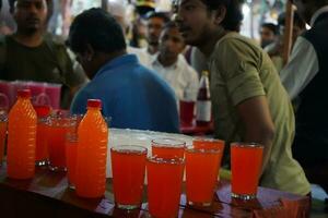 7th April 2023, Zakaria Street, Kolkata, West Bengal, India. Colorful and Refreshing drinks are for Sale at Zakaria Street During Eid al-Fitr photo