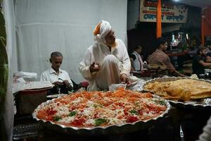 7th April 2023, Zakaria Street, Kolkata, West Bengal, India. Eid Special Halwa and Paratha at Zakaria Street near Nakhoda Masjid during Eid al-Fitr photo