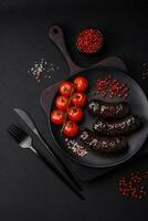 Delicious black blood sausage or black pudding with spices and herbs photo