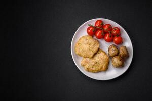 Delicious fried chopped fillet pancakes with spices, salt and herbs photo