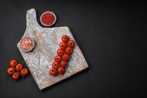 Knife, fork and cutting board, salt, pepper and other ingredients photo