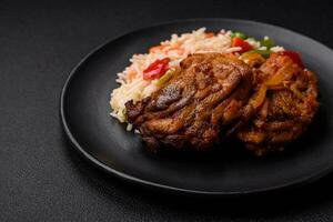 Delicious boiled rice with peppers, peas, asparagus beans and carrots and fried chicken photo