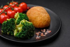 Delicious baked cutlet breaded with spices, salt and herbs photo