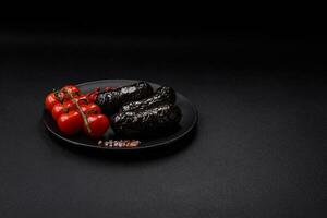 Delicious black blood sausage or black pudding with spices and herbs photo