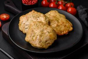 Delicious fried chopped fillet pancakes with spices, salt and herbs photo