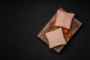 Delicious crispy toast with chicken or goose pate with salt and spices photo