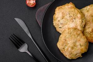 Delicious fried chopped fillet pancakes with spices, salt and herbs photo