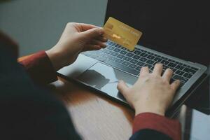 Women holding credit card and using smartphones at home.Online shopping, internet banking, store online, payment, spending money, e-commerce payment at the store, credit card, concept photo